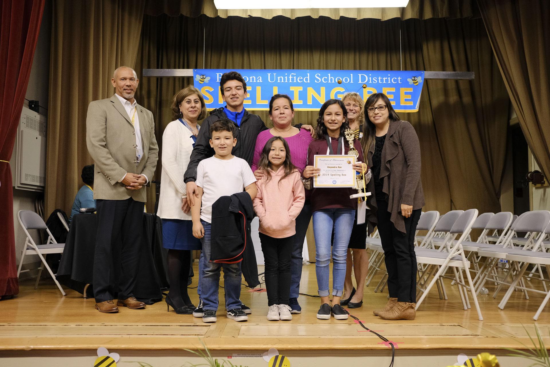 First place winner with her family, the spell master (Delbert Duckins), Lilia Fuentes, her teacher (Claudia Vasquez), and me.